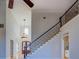 Open entryway with hardwood floors, staircase, and view to formal dining at 45 Kinloch Ct, Covington, GA 30014