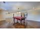 Spacious game room with a pool table and decorative lighting above at 45 Kinloch Ct, Covington, GA 30014