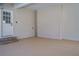 Spacious two car garage featuring finished walls and floor plus an exterior door at 45 Kinloch Ct, Covington, GA 30014