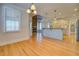 Spacious kitchen with hardwood floors, granite countertops and an island with barstool seating at 45 Kinloch Ct, Covington, GA 30014