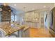 Granite counters accent this island kitchen with stainless appliances and plenty of storage at 45 Kinloch Ct, Covington, GA 30014