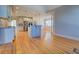 Bright kitchen features an island, stainless steel appliances, and a hardwood floor at 45 Kinloch Ct, Covington, GA 30014