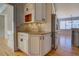 Kitchen nook features modern white cabinets, granite counters, stainless refrigerator at 45 Kinloch Ct, Covington, GA 30014
