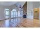 Spacious living room with hardwood floors, stone fireplace and large windows at 45 Kinloch Ct, Covington, GA 30014