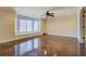 Expansive living room featuring lustrous floors, a bay window and stylish ceiling fan at 45 Kinloch Ct, Covington, GA 30014