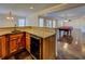 View of the wet bar with a wine cooler and the open living room with a pool table and outdoor access at 45 Kinloch Ct, Covington, GA 30014