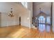 Open living room with hardwood floors, chandelier, staircase, and vaulted ceilings at 45 Kinloch Ct, Covington, GA 30014