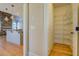 Walk-in pantry featuring wire shelving for organized storage next to the kitchen at 45 Kinloch Ct, Covington, GA 30014