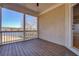 Screened-in porch overlooking a scenic view of the lake, perfect for relaxation at 45 Kinloch Ct, Covington, GA 30014