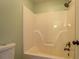 Full bathroom with standard tub shower, bronze shower head, and white porcelain toilet at 45 Kinloch Ct, Covington, GA 30014