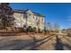 Side view of a beautiful home with a well-manicured lawn and lake view at 45 Kinloch Ct, Covington, GA 30014