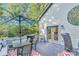 Outdoor deck with patio furniture and grill perfect for outdoor entertaining and enjoying the natural surroundings at 8535 Lynn Dr, Cumming, GA 30041