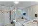 Bathroom suite with bathtub, stand up shower and dual sinks at 8535 Lynn Dr, Cumming, GA 30041
