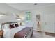 Cozy bedroom features a metal bed frame, unique decor, and an exterior door for easy access at 8535 Lynn Dr, Cumming, GA 30041