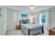 Serene bedroom with soft blue accents, a wooden bed frame, and a bright window with natural light at 8535 Lynn Dr, Cumming, GA 30041