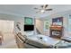 Finished basement features comfortable seating, fireplace, media center and ample lighting at 8535 Lynn Dr, Cumming, GA 30041