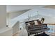 An image of a grand piano near a staircase in a bright room, highlighting the home's musical potential at 8535 Lynn Dr, Cumming, GA 30041