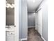 Bathroom hallway with gray walls and carpet flooring at 1114 Ivey Chase Pl, Dacula, GA 30019