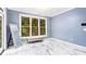 Bright bedroom with marble floors and large windows at 1114 Ivey Chase Pl, Dacula, GA 30019