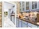 Kitchen with blue cabinets and granite countertops at 1114 Ivey Chase Pl, Dacula, GA 30019