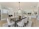 Open concept dining area with hardwood floors and large windows at 1682 Union Grove Church Rd, Auburn, GA 30011