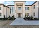 Elegant entryway with a modern door and landscaping at 1682 Union Grove Church Rd, Auburn, GA 30011