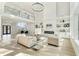 Two-story living room with fireplace and built-in shelving at 1682 Union Grove Church Rd, Auburn, GA 30011