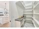 Well-organized pantry with ample shelving and counter space at 1682 Union Grove Church Rd, Auburn, GA 30011