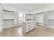 Large walk-in closet with ample shelving and island at 1682 Union Grove Church Rd, Auburn, GA 30011