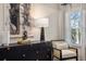 Bedroom featuring modern decor with a dark dresser, accent chair, and natural light at 24 Jacobs Farm Ln # 12, Loganville, GA 30045