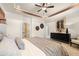 Bedroom with trey ceiling, stylish decor and an adjacent bathroom and walk-in closet at 24 Jacobs Farm Ln # 12, Lawrenceville, GA 30045