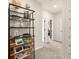 Bright hallway featuring modern shelving with decorative items and an accent wall with a height chart at 24 Jacobs Farm Ln # 12, Lawrenceville, GA 30045