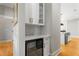 Bar area with wine refrigerator, white cabinets, and modern backsplash at 2715 Memorial Se Dr, Atlanta, GA 30317