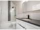 Modern bathroom features a sleek vanity, white marble, and black accents at 2715 Memorial Se Dr, Atlanta, GA 30317