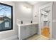 Bathroom featuring a double vanity with quartz countertop and walk-in closet at 2715 Memorial Se Dr, Atlanta, GA 30317