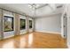 Spacious bedroom with large windows, hardwood floors, and tray ceiling at 2715 Memorial Se Dr, Atlanta, GA 30317