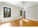 Bedroom with hardwood floors, modern lighting, and large windows at 2715 Memorial Se Dr, Atlanta, GA 30317