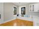 Bright dining room features a built-in bench under large windows and a serving area with white cabinets at 2715 Memorial Se Dr, Atlanta, GA 30317