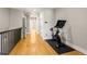 Hallway features hardwood floors, a peloton, and white trim at 2715 Memorial Se Dr, Atlanta, GA 30317