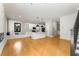 Bright living room with a large island, white cabinets, and open sight lines to the stairs and entryways at 2715 Memorial Se Dr, Atlanta, GA 30317