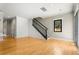 View of stairs, white wainscoting, and glass patio doors with lots of natural light at 2715 Memorial Se Dr, Atlanta, GA 30317