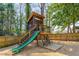 Unique backyard playhouse with a slide, stairs, and seating area for ' enjoyment at 2715 Memorial Se Dr, Atlanta, GA 30317