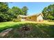 Ranch house with a large backyard, providing ample space for outdoor activities at 780 Navajo Trl, Covington, GA 30016