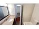 Cozy bathroom with a white vanity, framed mirror, and a shower-tub combination at 780 Navajo Trl, Covington, GA 30016