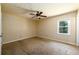 Bedroom with carpet flooring, ceiling fan and window at 780 Navajo Trl, Covington, GA 30016