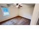 Bedroom with neutral walls, carpet flooring, ceiling fan, and a window providing natural light at 780 Navajo Trl, Covington, GA 30016