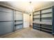 Large walk-in closet with built-in shelves and rods at 780 Navajo Trl, Covington, GA 30016