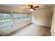 Sunroom featuring windows with a ceiling fan and exterior door at 780 Navajo Trl, Covington, GA 30016