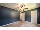 Bedroom with ceiling fan and doors to hallway at 780 Navajo Trl, Covington, GA 30016