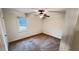 Bedroom with neutral carpet, ceiling fan and a bright window at 780 Navajo Trl, Covington, GA 30016